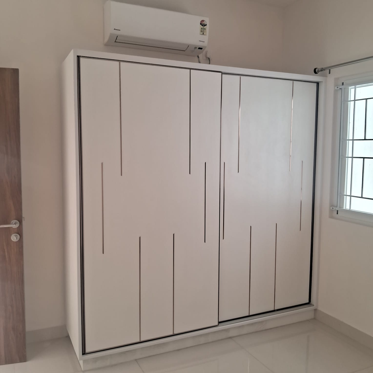 White wardrobe with thin branching line-cutout pattern