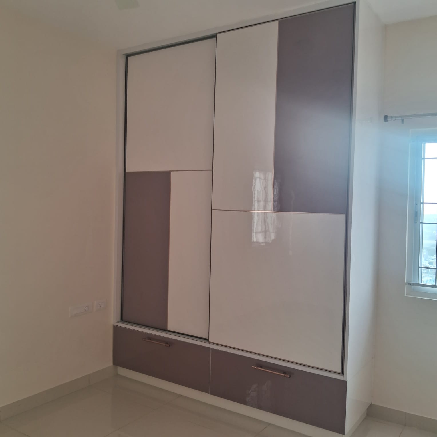 Mauve and grey angular-pattern wardrobe with copper handles